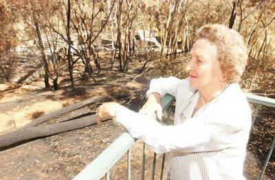 BURN  OUT: Founding member Maisie Harvey surveys the three burnt out ranges and scorers shed at the Orange Pistol Club’s Fanning Lane site. Photo: JUDE KEOGH