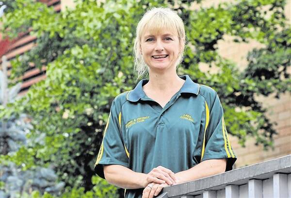 OUT OF THE SHADOWS: After living in fear in her native South Africa, Orange resident Lara Cowling is making a name for herself as an administration assistant at CSU and on the pistol range. Photo: JUDE KEOGH  0310cowling2