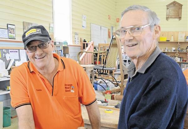 CHIPPING AWAY: Orange Men's Shed members Denis Barton and Don Hume believe it's hard to enjoy retirement because of concerns they won't have saved enough money. Photo: LUKE SCHUYLER  0619menshed