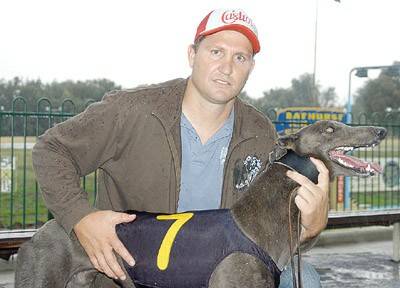 LEAGUE PEDIGREE: Former South Sydney player Michael Francis with Terry Hill produced hound, Wild Blue Boy after winning the Michael and Lynn Maney Appreciation over 520 metres at Kennerson Park on Monday night.