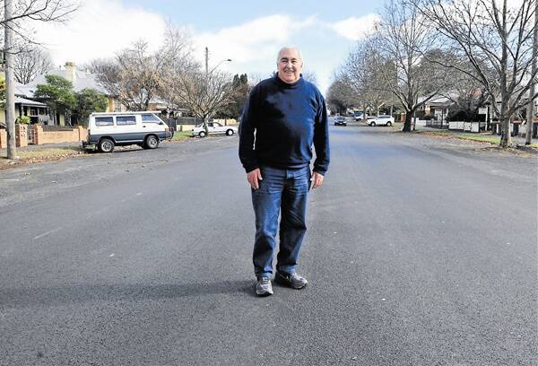 EXCELLENT SURFACE: Car enthusiast Denis Gregory says plans to resurface streets in Orange with hot mix asphalt like in Kite Street will mean a smoother, safer ride for drivers. 