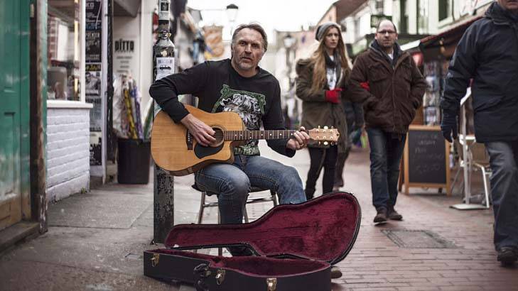 Guitar man ... Neil Brooks busking in London "making a few bob, putting food on the table".