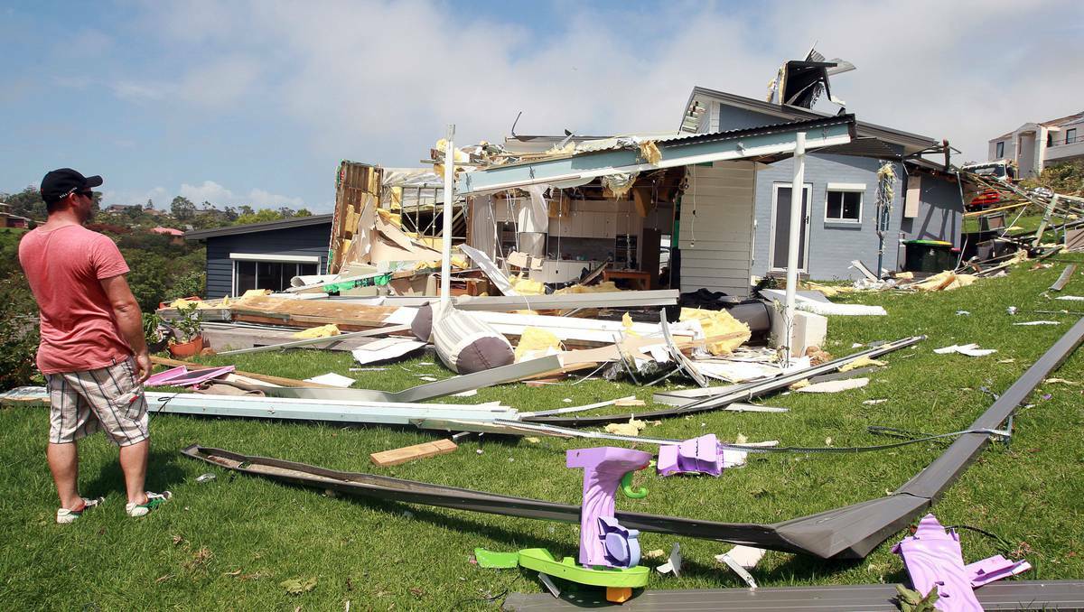 Paul Cooper surveys the damage to his house in Bele Place, Kiama. Photo: SYLVIA LIBER