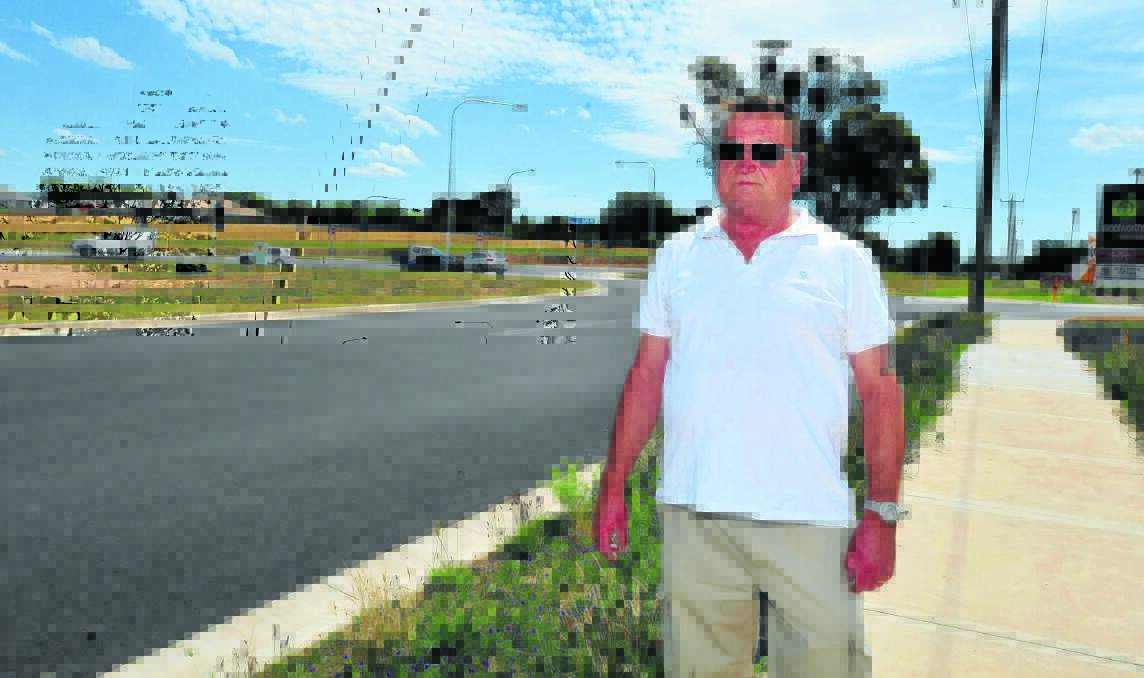 SPITTING CHIPS: Farrell Road resident Vic Adams doesn’t believe the north Orange McDonald’s should be approved until the dangerous intersection is fixed.  Photo: JUDE KEOGH 1202farrellrd