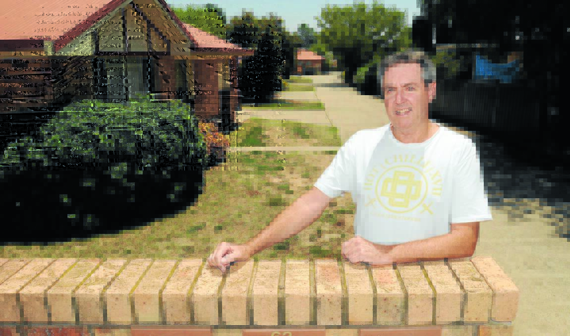 BUBBLE HAS BURST: Builder/investor Kevin Wright, who owns several rental properties in Orange, says rents have dropped to a more reasonable rate compared to 18 months ago.  Photo: STEVE GOSCH  0113sgrent2