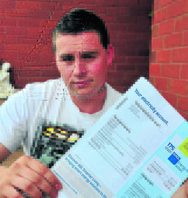 ELECTRIC SHOCK: Mitchell Stewart has asked his energy supplier to investigate his electricity bill of $2227. Photo: LUKE SCHUYLER   ­­­1117lshugebill