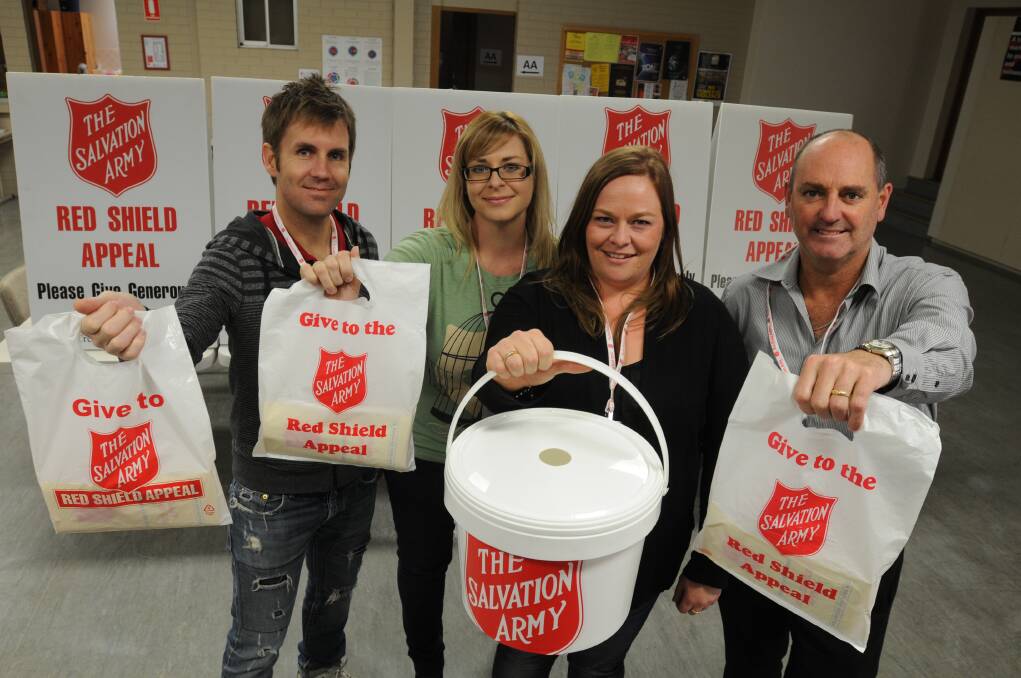 KNOCK KNOCK: Brad and Helen Whittle, WHK employee Laura Murray and Red Shield Appeal business chairman Tony Rodd will be among hundreds of volunteers in tomorrow's doorknock.