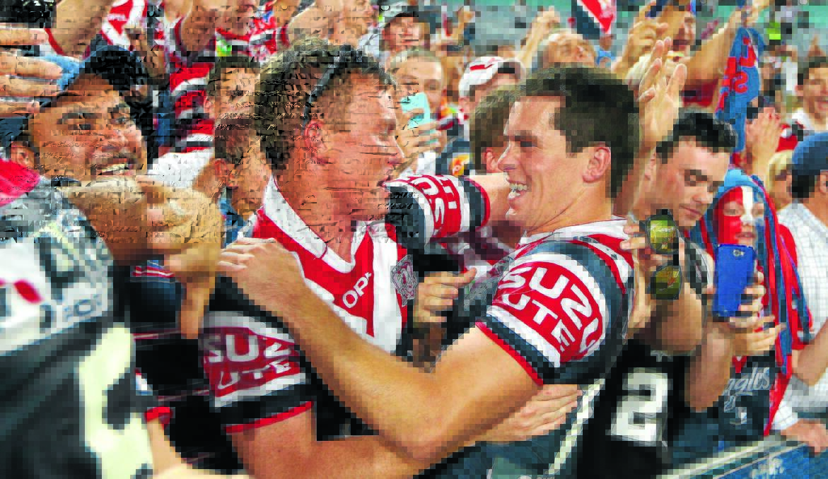 CROWD FAVROUITE: Orange’s Daniel Mortimer celebrates with fans after the Sydney Roosters won the NRL grand final on Sunday night. Photo: GETTY IMAGES