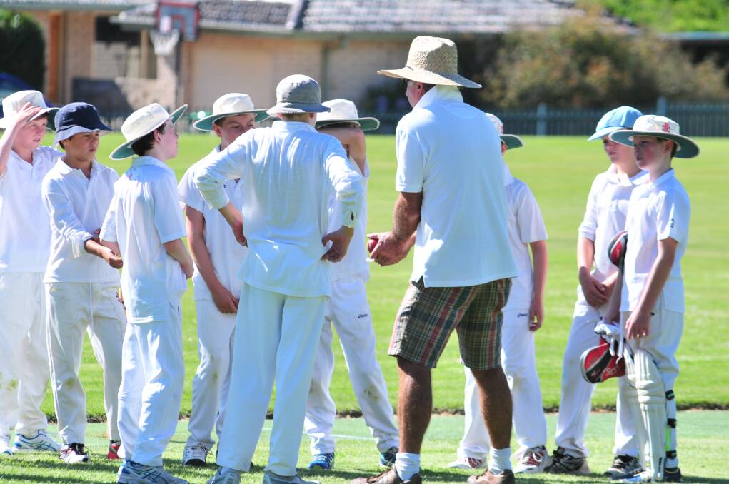 The Kinross Wolaroi side take in the advice of coach Rob McLean on Saturday morning. Photo: JUDE KEOGH