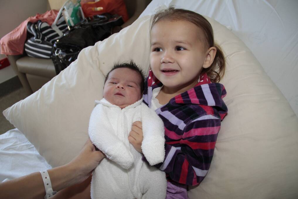 Lara Violet Travis, pictured with older sister Phoebe, was born on January 11. Lara is the daughter of Lisa and Alastair Travis.