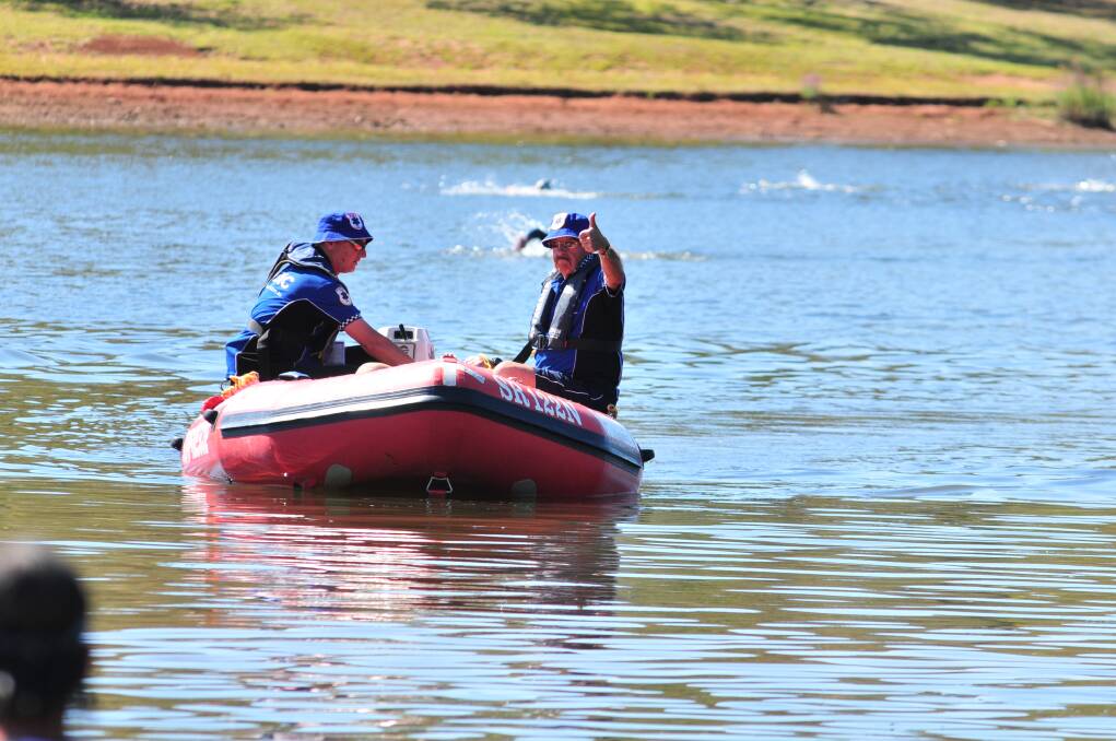 Spotters on Lake Canobolas pick up an athlete suffering from fatigue. Photo: JUDE KEOGH