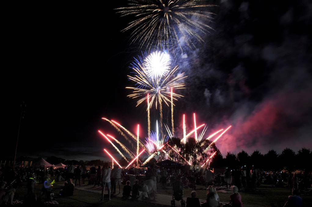 ORANGE: The fireworks light up the Orange skyline on New Year's Eve. Photo: STEVE GOSCH