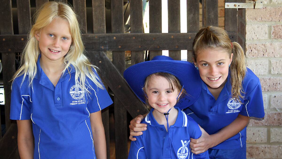 Sophie Ablett, Estella Rome and Amber Ablett, who received detention for hugging a classmate.