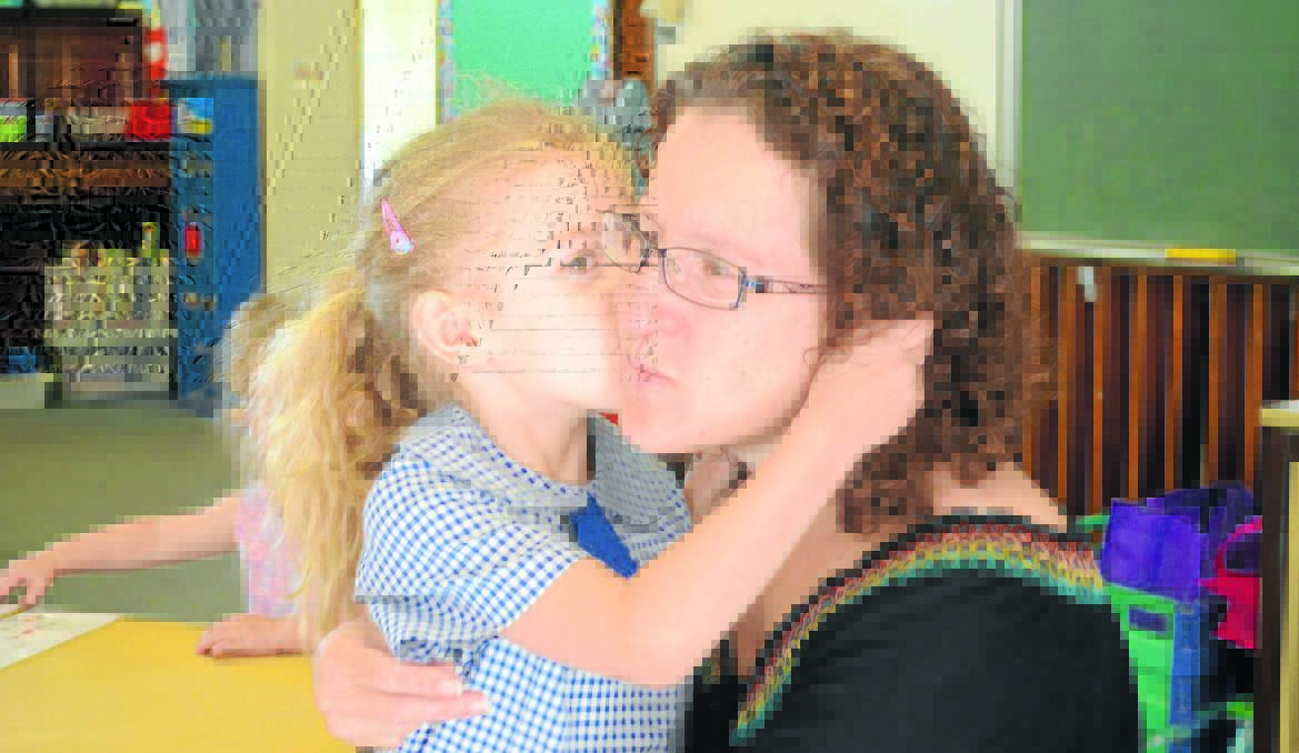 PRIDE AND JOY: Ayanna Hope was all smiles at her first day of classes at Orange Public School while mum Justine unsuccessfully held back tears. Photo: NICOLE KUTER  0204nkops1,2