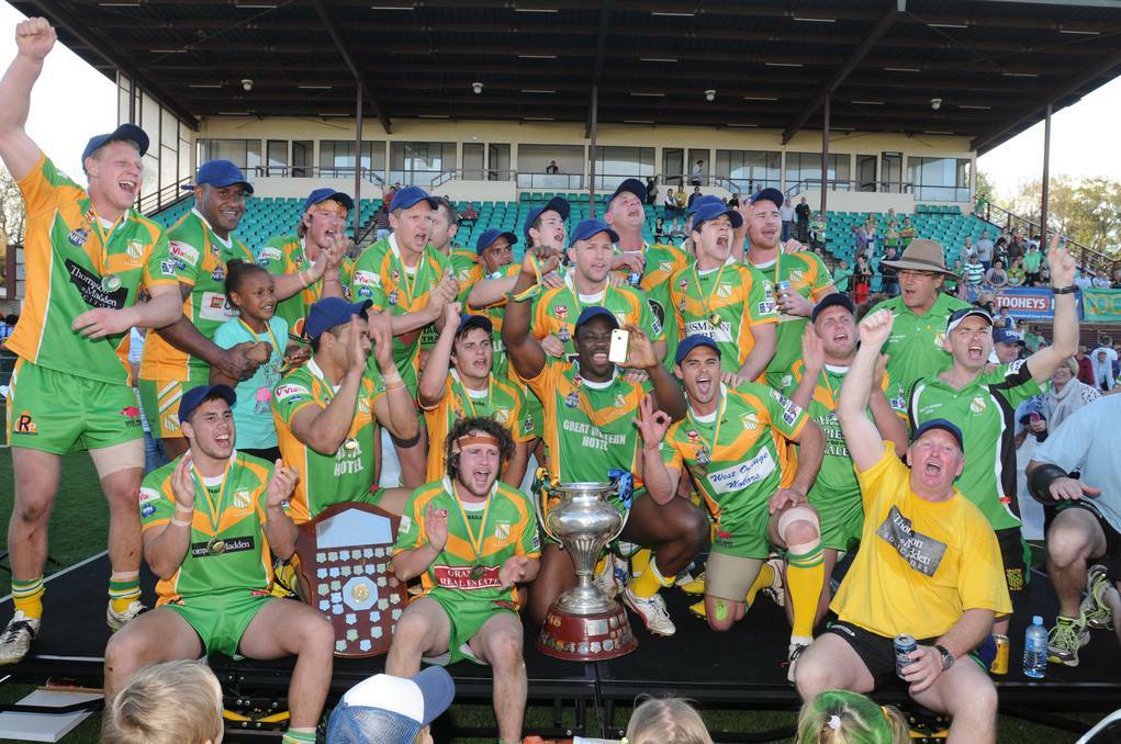  Orange CYMS celebrate their Group 10 premier league premiership after yesterday’s win over Hawks at Wade Park. Photo: STEVE GOSCH 0908sgleague24