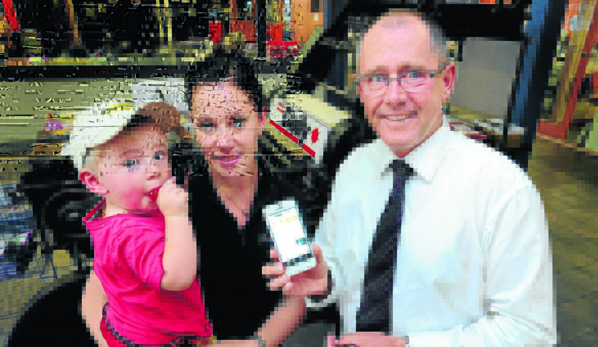 MORE THAN ’APPY : Danielle Jolliffe with son Joshua and CWD managing editor Tony Rhead was very excited to hear she had won an iPhone 5 thanks to the Central Western Daily. 