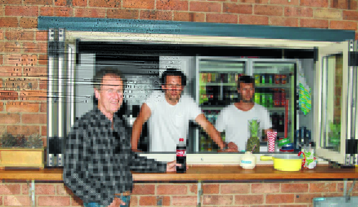 NEW LOOK: Customer Richard Harrison with The Lakehouse proprietor Ben Crawley and his brother Sam. Photo: JEFF DEATH.
