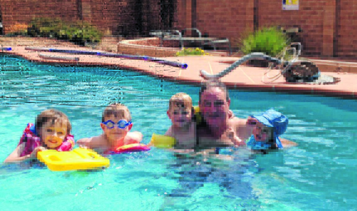 SUMMER IN THE POOL:  Summer is great because I get to spend quality time with my grandkids in the family pool. Submitted by Peter Ball. 