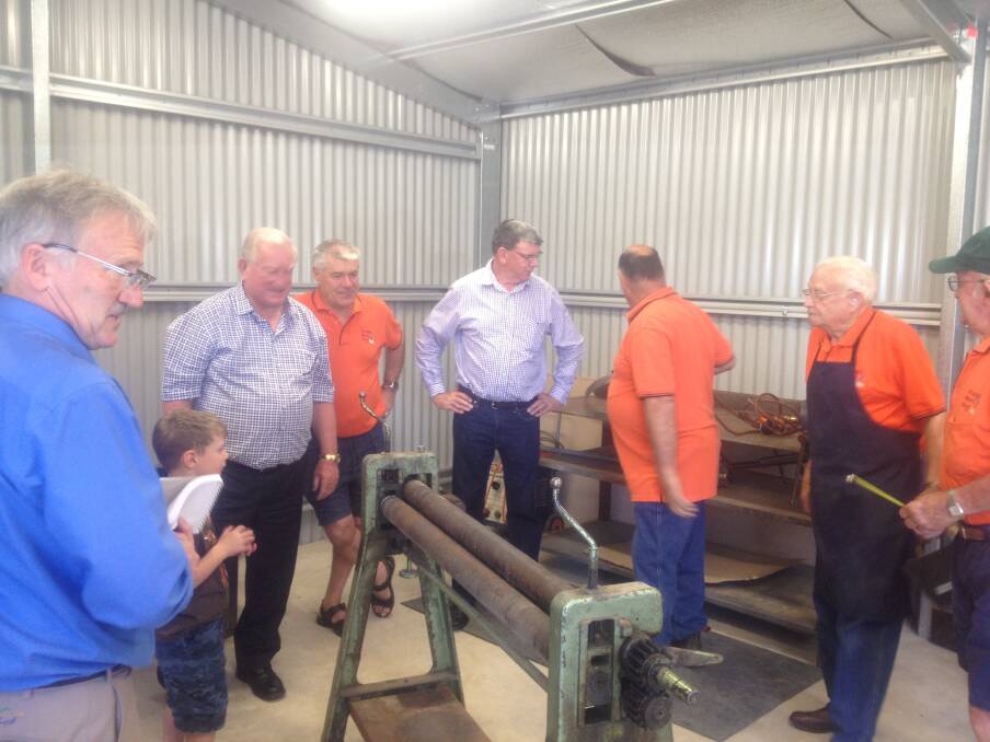 NEW SKILLS: Orange City Council mayor John Davis officially opened the new metal work area at the Orange Men's Shed this morning, he is pictured with men's shed members. Photo: NADINE MORTON 1113nmmenonline