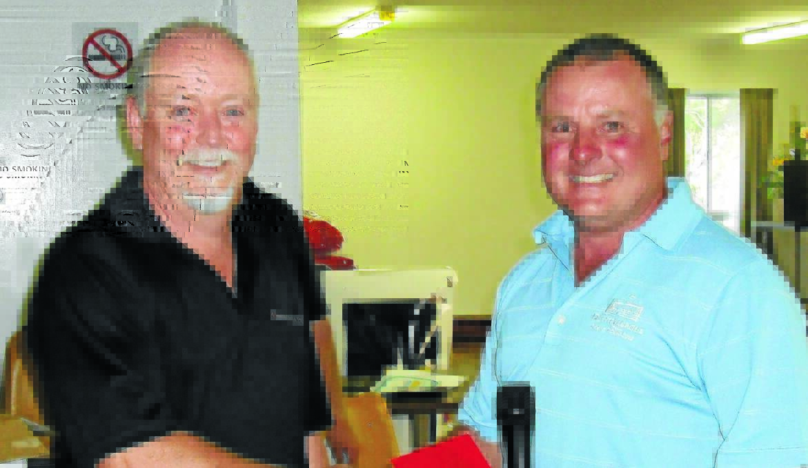 BACK ON TOP: Blayney Open winner Rob Parfett (right) is presented his award by sponsor Ted Dwyer from Nestle Purina.