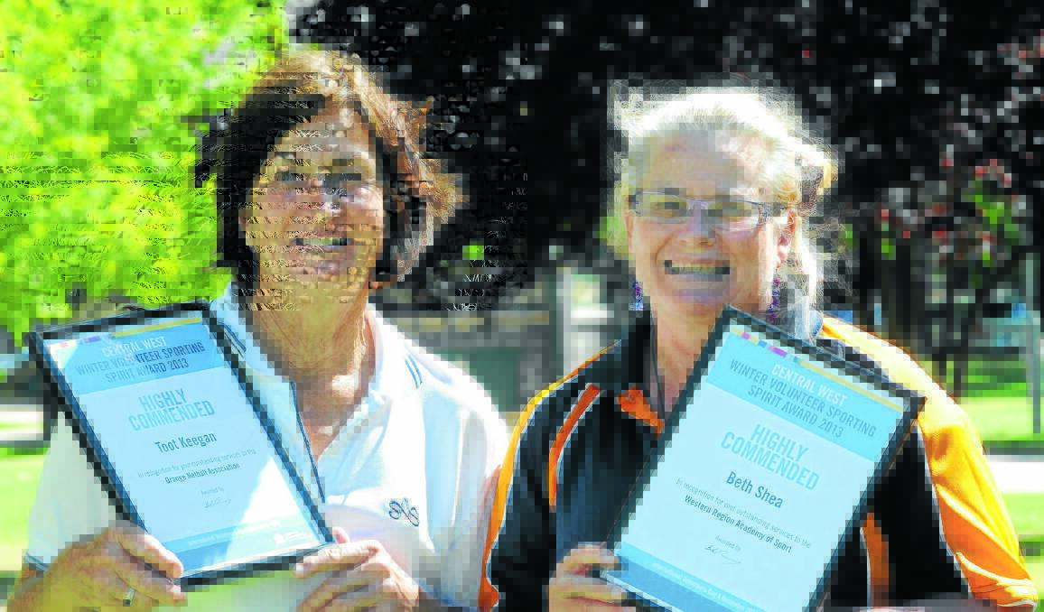 WE LOVE IT: Yvonne 'Toot' Keegan and Beth Shea receive their Central West Volunteer Sporting Spirit awards on Wednesday. Photo: STEVE GOSCH 1210sgsport.