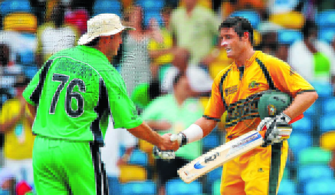 WELL DONE: Bowen Centrals junior David Langford-Smith shakes the hand of retiring Australian batsman Mike Hussey in the ICC Cricket World Cup Super Eights match between Australia and Ireland at the Kensington Oval on April 13, 2007 in Bridgetown, Barbados.